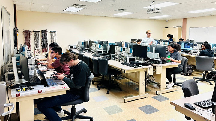 Students working in a large lab room